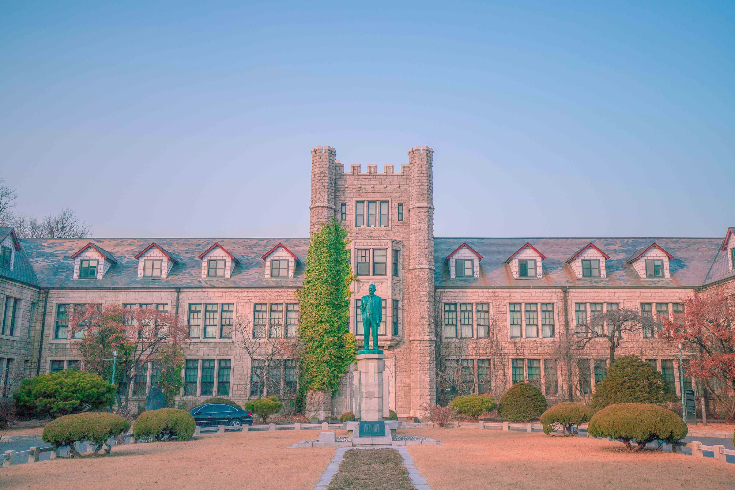 Stone buildings and gardens on a university campus